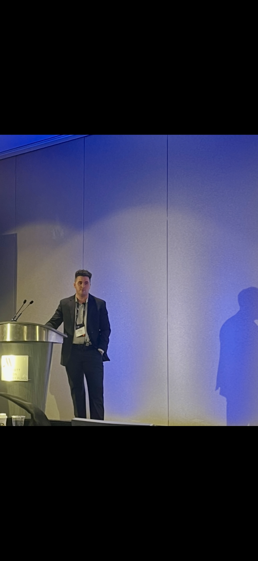 Lucas Tierney speaking at a GTM conference